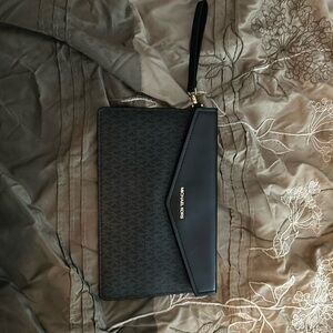 Michael Kors clutch. Black with grey interior. Like new.